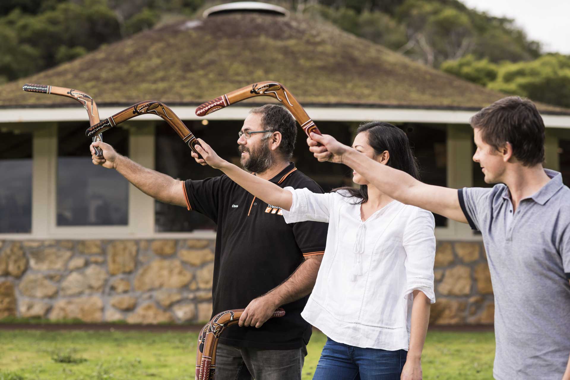 A hands-on boomerang throwing lesson at Tower Hill, connecting visitors with Indigenous traditions.