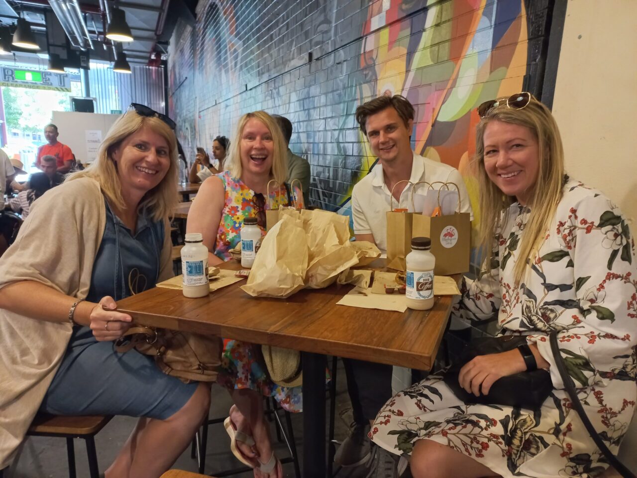 Group photo of travellers who joined the F Factor Tour in the Adelaide Central Market