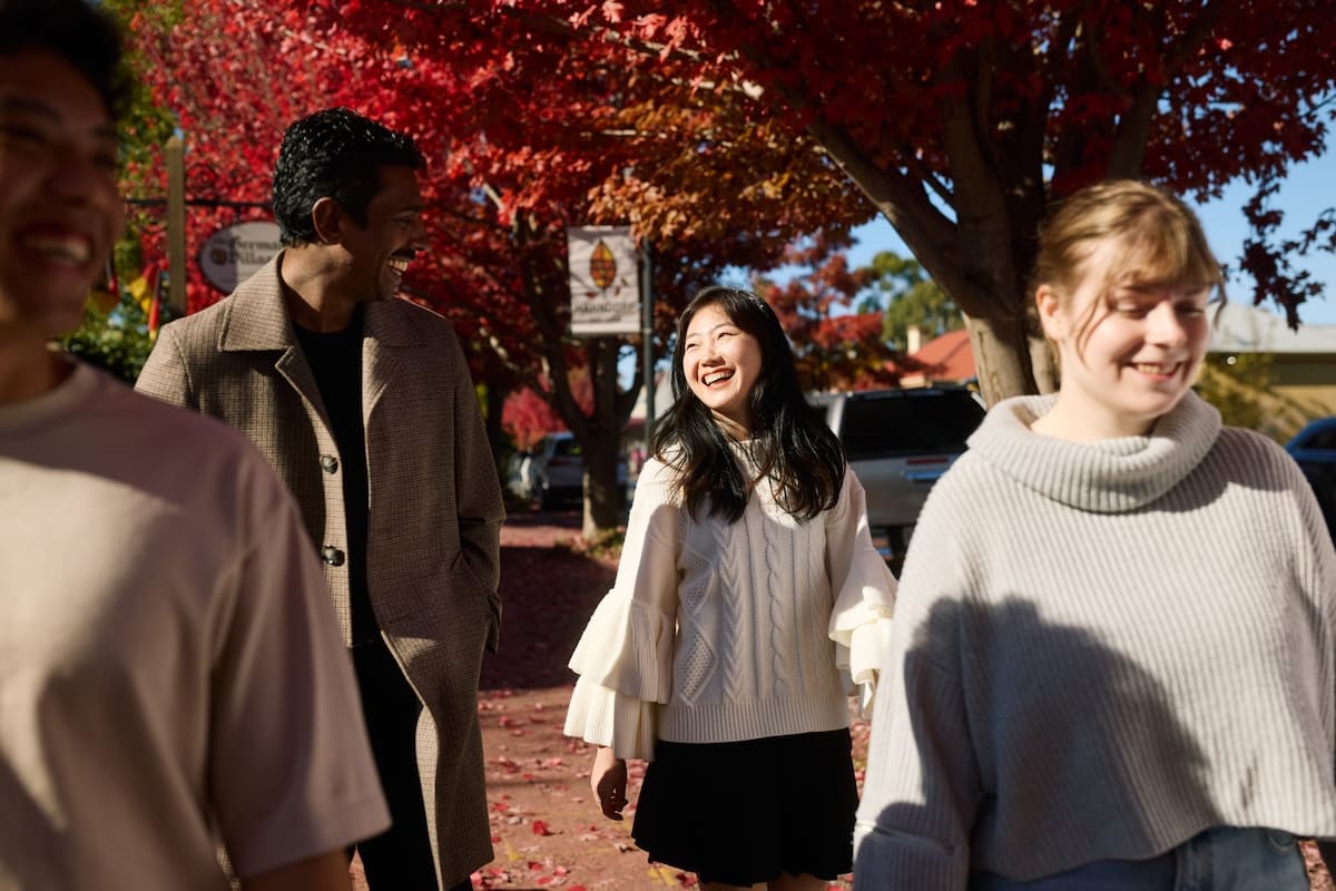 Friends wandering through Hahndorf in autumn